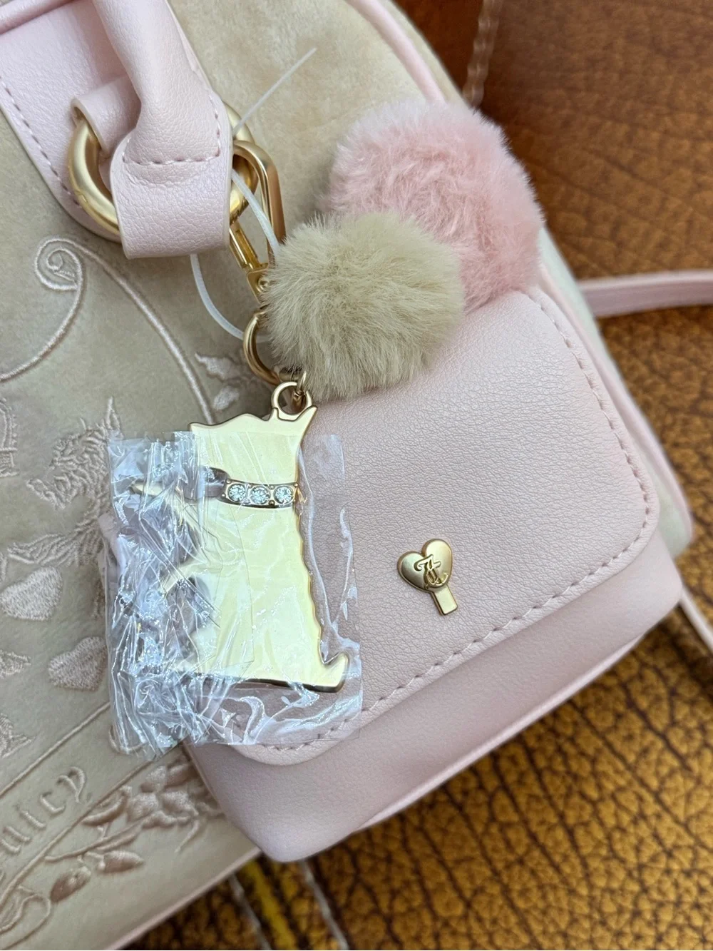 Juicy Couture Blush Pink Suede and Leather Satchel with Pom-Pom Charm